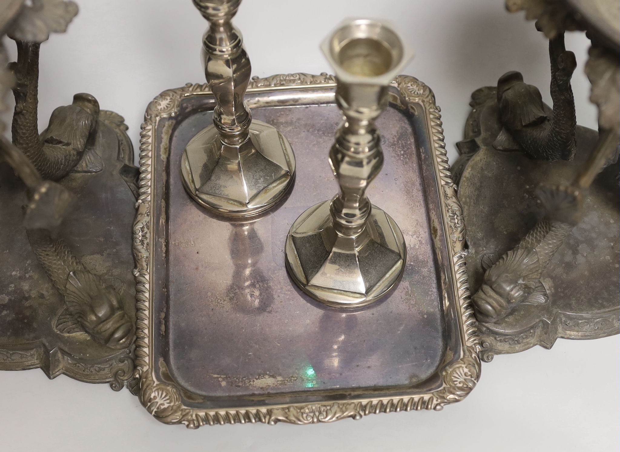 A pair of silver plated Philip Ashberry & Sons dolphin tazza’s, impressed 656 to the bases, together with a tray and pair of candlesticks, the largest each 23cm high